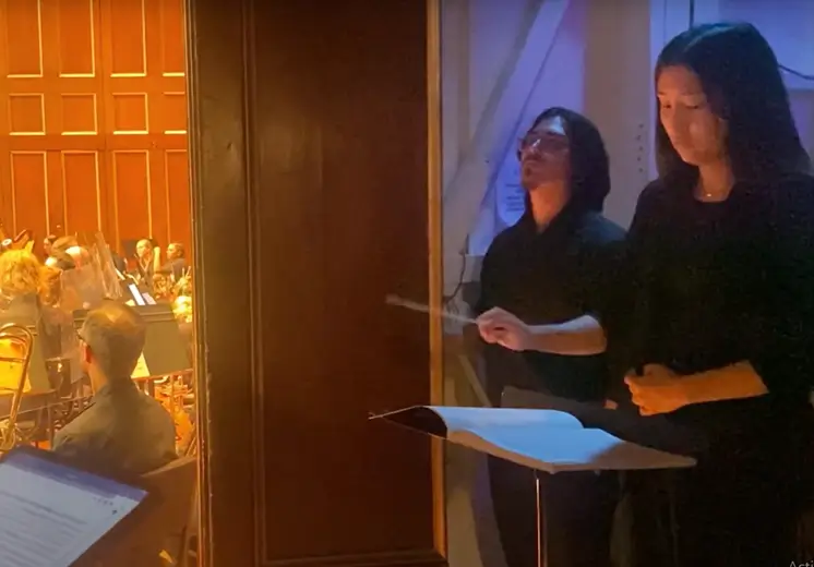 two people near a doorway